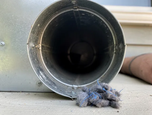 Griswold Dryer Vent Cleaning technician using specialized equipment to clear severe dryer vent blockage in Griswold